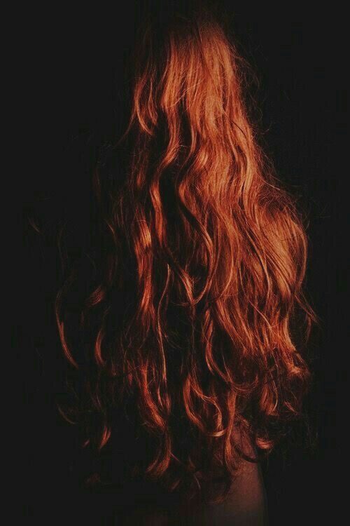 Long copper-red hair, coloured and finished