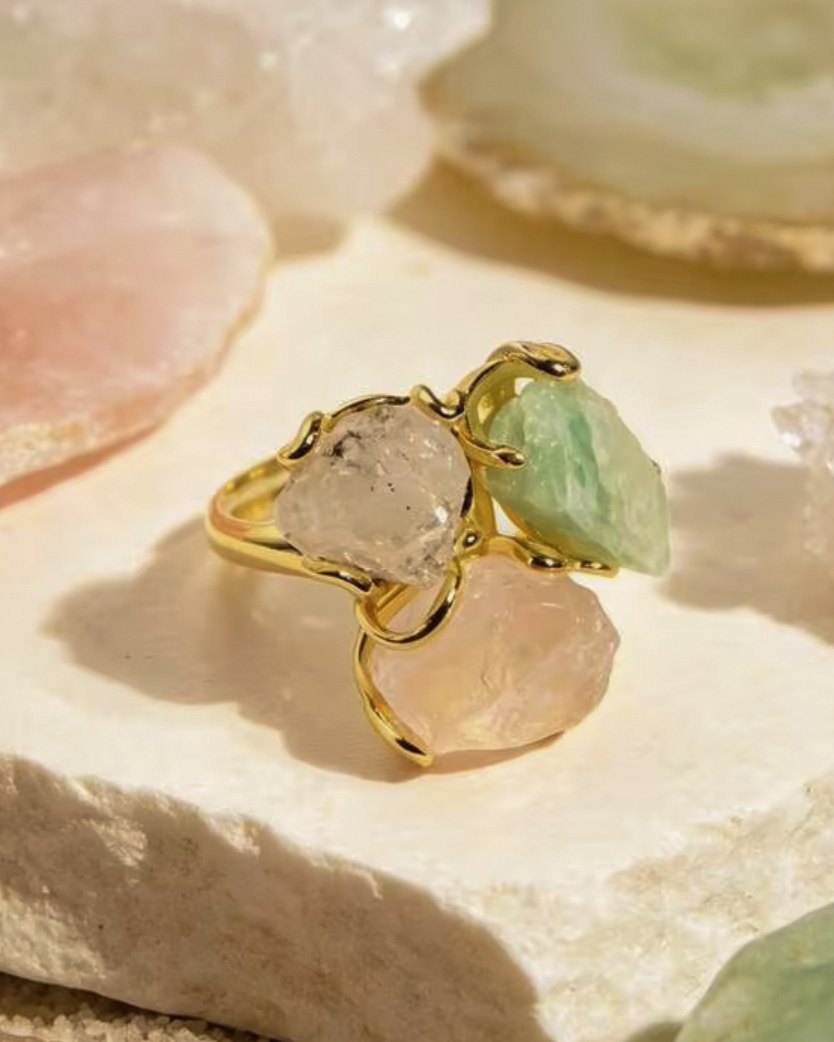Alba — raw crystal ring with blush pink, pale green and clear natural stones in a fine gold-toned setting